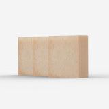 Three aligned bars of gentle tallow soap, in a soft, pale beige tone, displaying a smooth, hand-cut finish that hints at the soap's creamy and moisturizing qualities.