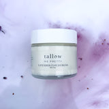 Elegant jar of Tallow Me Pretty Lavender Cloud Cream set against a diffuse purple backdrop, highlighting the cream's serene, luxurious qualities and the calming effects of lavender.