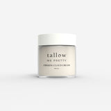An elegant jar of Tallow Me Pretty Firming Body Cloud Cream, presented against a clean, neutral background. The jar is labeled with a minimalist design that emphasizes the natural and luxurious essence of the cream, promising a nourishing and firming experience for the skin.