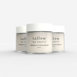 Three jars of Tallow Me Pretty Firming Body Cloud Cream aligned in a row, showcasing the elegant and minimalistic design of the packaging that encases the luxurious, skin-firming cream within.